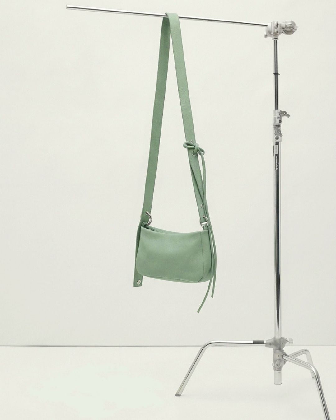 Loli - Medium leather bag with strap and multiposition carabiners SS26