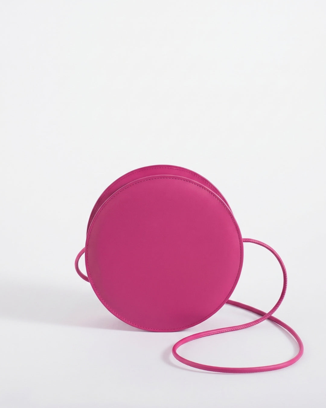 Marcelina in Strawberry leather · round bag in vegetable-tanned leather, handmade in Málaga · Labienhecha